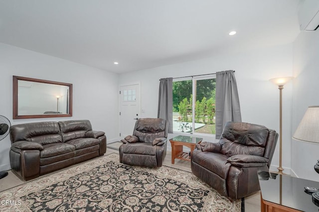 living room featuring a wall mounted AC, recessed lighting, wood finished floors, and baseboards