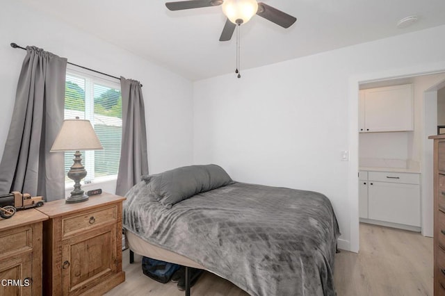 bedroom featuring light wood-type flooring and ceiling fan