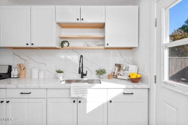 bar with a sink and tasteful backsplash