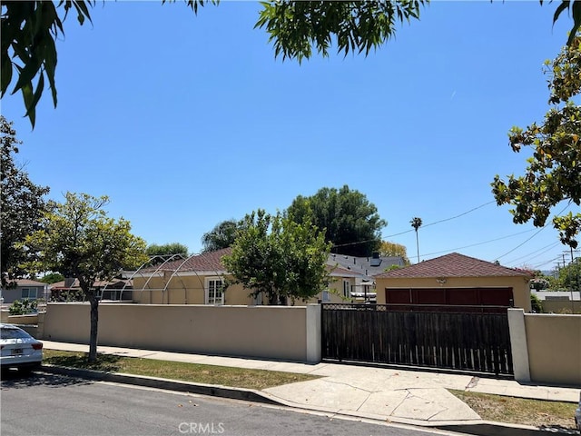 6355 Peach Ave, Van Nuys, CA 91411 - view of front of house featuring a fenced front yard, stucco siding, and a gate