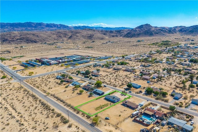 drone / aerial view of mountains and a desert landscape