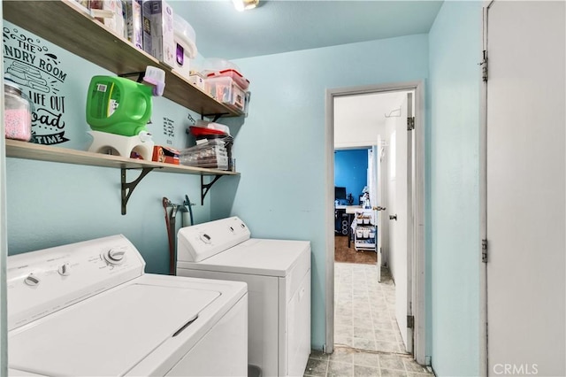 washroom with washing machine and clothes dryer