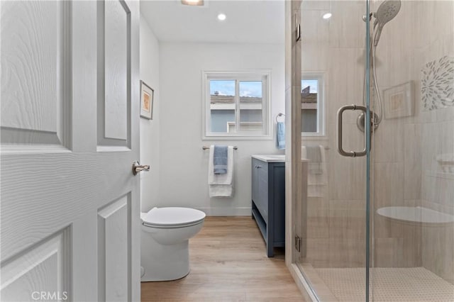5331 E Ocean Blvd, Long Beach, CA 90803 - bathroom featuring a stall shower, vanity, wood finished floors, and recessed lighting