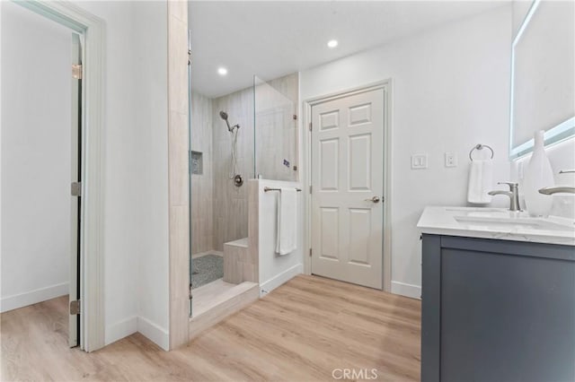 5331 E Ocean Blvd, Long Beach, CA 90803 - full bathroom with walk in shower, vanity, wood finished floors, and recessed lighting