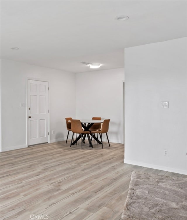 5331 E Ocean Blvd, Long Beach, CA 90803 - dining area featuring light wood-type flooring and baseboards