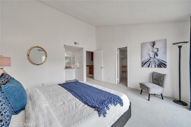 109 N Nicholson Ave Unit A, Monterey Park, CA 91755 - carpeted bedroom featuring a walk in closet, a textured ceiling, connected bathroom, high vaulted ceiling, and a closet