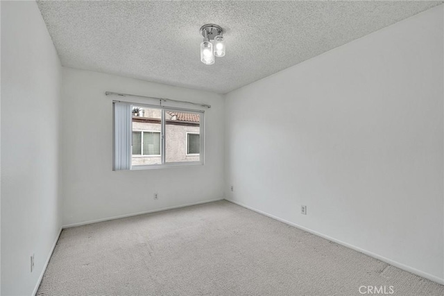 109 N Nicholson Ave Unit A, Monterey Park, CA 91755 - carpeted spare room with a textured ceiling and baseboards