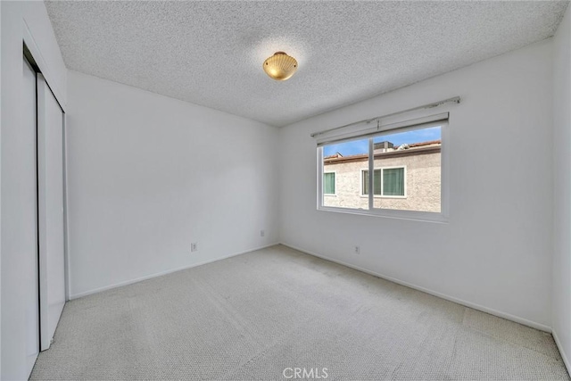 109 N Nicholson Ave Unit A, Monterey Park, CA 91755 - carpeted empty room with a textured ceiling and baseboards