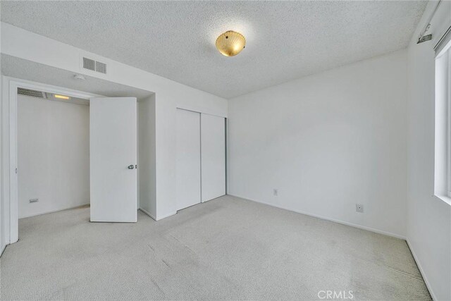 109 N Nicholson Ave Unit A, Monterey Park, CA 91755 - unfurnished bedroom with carpet floors, a textured ceiling, a closet, and baseboards