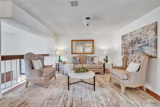 109 N Nicholson Ave Unit A, Monterey Park, CA 91755 - living room with a textured ceiling, baseboards, and wood finished floors
