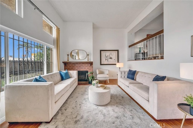 109 N Nicholson Ave Unit A, Monterey Park, CA 91755 - living area with wood finished floors and a brick fireplace