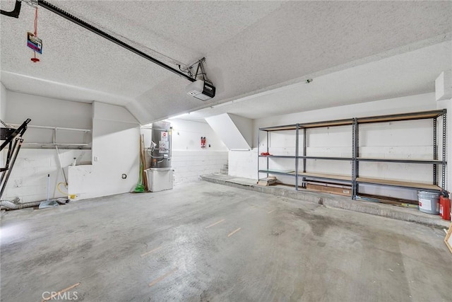 109 N Nicholson Ave Unit A, Monterey Park, CA 91755 - garage featuring a garage door opener and secured water heater