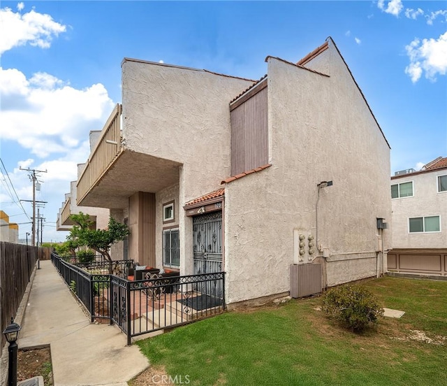 109 N Nicholson Ave Unit A, Monterey Park, CA 91755 - rear view of property with stucco siding and a patio