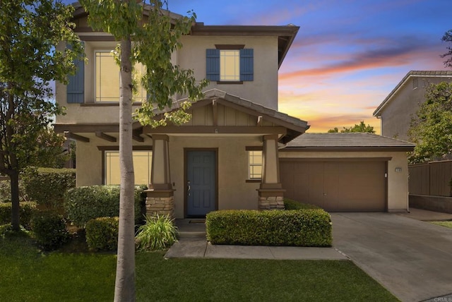 1109 Chimney Flats Ln, Chula Vista, CA 91915 - view of front of house with stucco siding, driveway, an attached garage, and a lawn