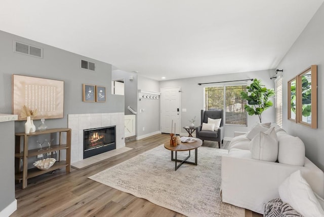 1109 Chimney Flats Ln, Chula Vista, CA 91915 - living room with wood finished floors, a fireplace, baseboards, and recessed lighting