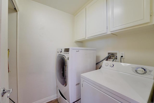 178 Via Montisi, Santee, CA 92071 - clothes washing area featuring washer and clothes dryer, cabinet space, and baseboards