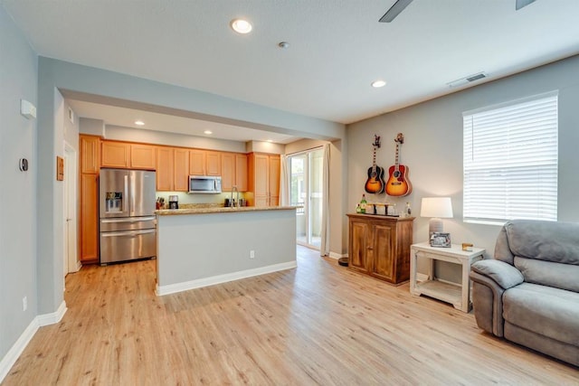 178 Via Montisi, Santee, CA 92071 - kitchen with stainless steel appliances, open floor plan, light wood finished floors, plenty of natural light, and recessed lighting