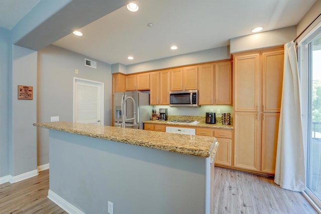 178 Via Montisi, Santee, CA 92071 - kitchen with stainless steel appliances, light wood-style flooring, a center island with sink, recessed lighting, and baseboards