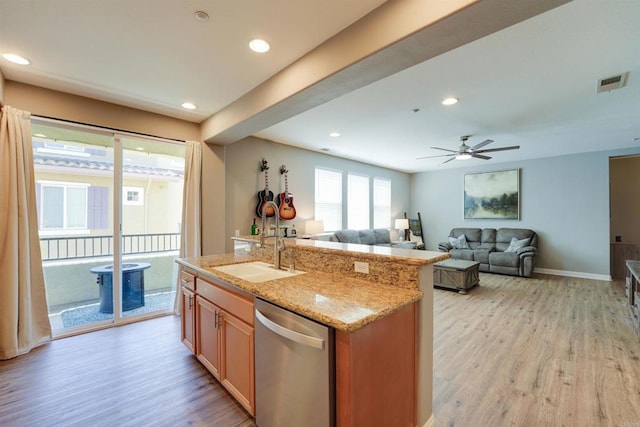 178 Via Montisi, Santee, CA 92071 - kitchen with dishwasher, a sink, light wood-type flooring, light stone counters, and open floor plan