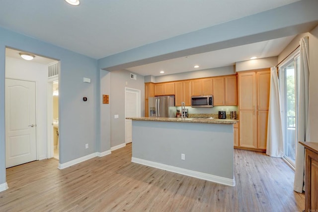 178 Via Montisi, Santee, CA 92071 - kitchen with stainless steel appliances, light wood-style floors, baseboards, an island with sink, and recessed lighting