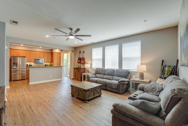 178 Via Montisi, Santee, CA 92071 - living room with a ceiling fan, light wood finished floors, recessed lighting, and baseboards