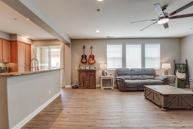 178 Via Montisi, Santee, CA 92071 - living area with light wood-style flooring, ceiling fan, recessed lighting, and baseboards