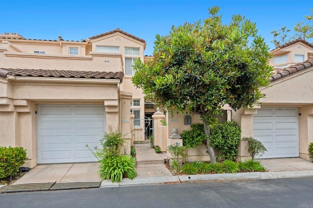 16054 Circa De Lindo, Rancho Santa Fe, CA 92091 - view of property featuring stucco siding, a tiled roof, a garage, and a gate