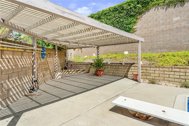 view of patio / terrace with a pergola and a fenced backyard