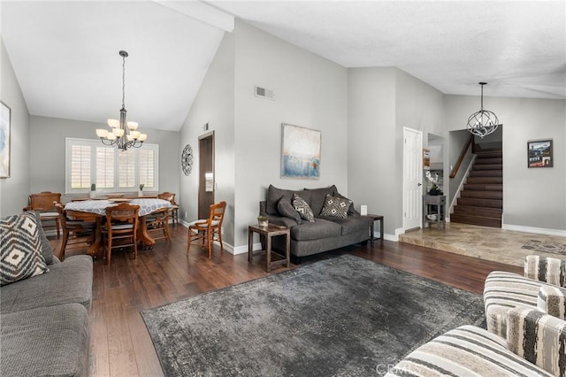 living room with a chandelier, stairs, wood finished floors, baseboards, and high vaulted ceiling