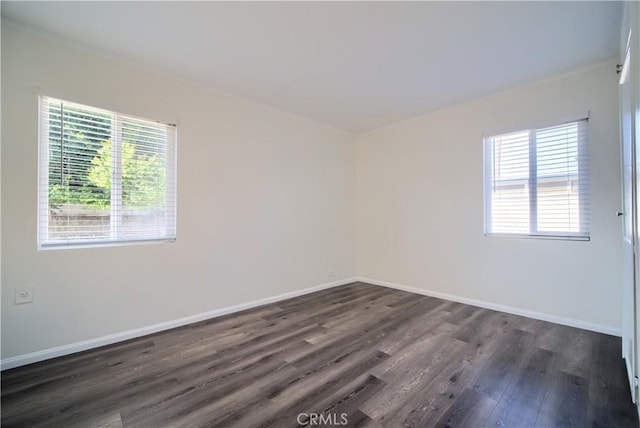 214 E Marshall Blvd, San Bernardino, CA 92404 - empty room with dark wood finished floors and baseboards