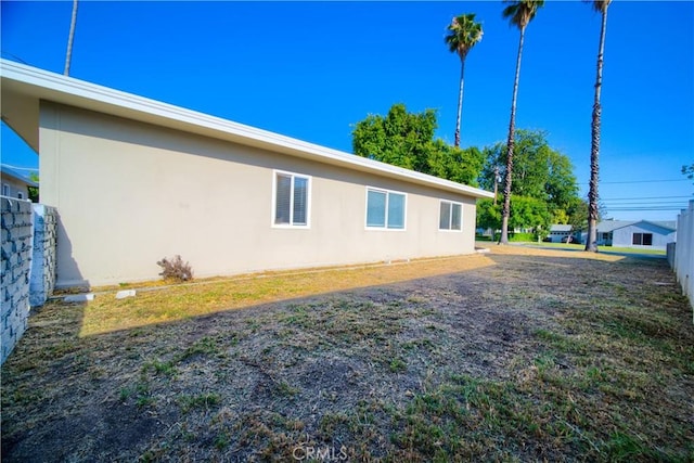 214 E Marshall Blvd, San Bernardino, CA 92404 - view of home's exterior featuring stucco siding