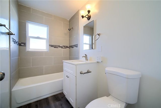 214 E Marshall Blvd, San Bernardino, CA 92404 - bathroom featuring vanity,  shower combination, and wood finished floors
