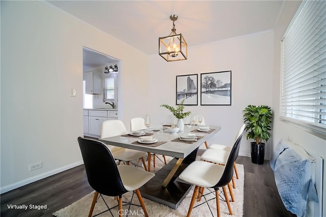 214 E Marshall Blvd, San Bernardino, CA 92404 - dining space featuring wood finished floors, a chandelier, and ornamental molding