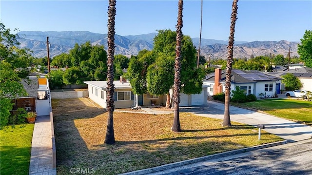 214 E Marshall Blvd, San Bernardino, CA 92404 - view of front of home with driveway, a mountain view, and a front yard