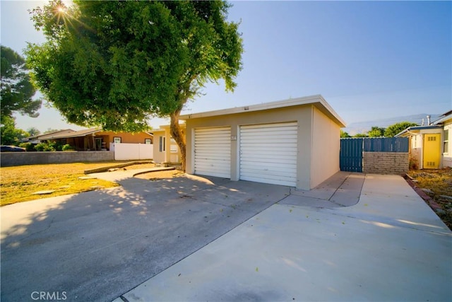 214 E Marshall Blvd, San Bernardino, CA 92404 - garage featuring driveway