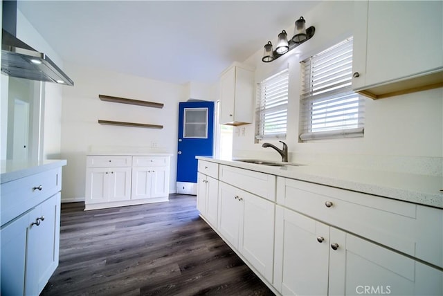 214 E Marshall Blvd, San Bernardino, CA 92404 - kitchen with light countertops, dark wood-style flooring, white cabinetry, and open shelves