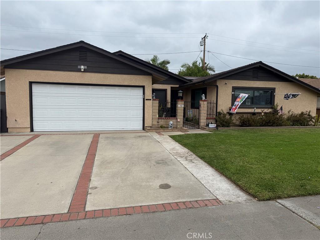 1467 W Southgate Ave, Fullerton, CA 92833 - ranch-style home with driveway, stucco siding, a garage, and a gate