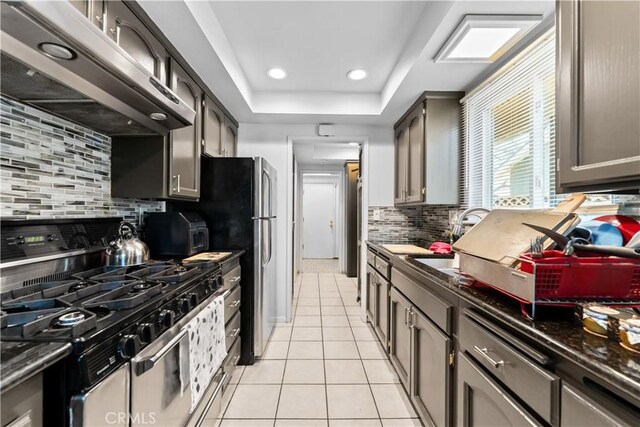 1467 W Southgate Ave, Fullerton, CA 92833 - kitchen with stainless steel appliances, ventilation hood, light tile patterned flooring, tasteful backsplash, and recessed lighting
