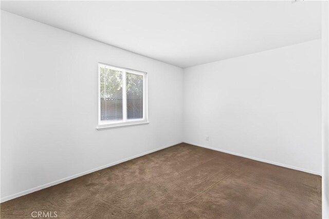 1467 W Southgate Ave, Fullerton, CA 92833 - empty room featuring dark carpet and baseboards
