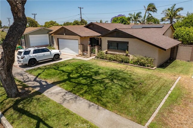 1467 W Southgate Ave, Fullerton, CA 92833 - view of front of home featuring stucco siding, a front yard, roof with shingles, concrete driveway, and solar panels