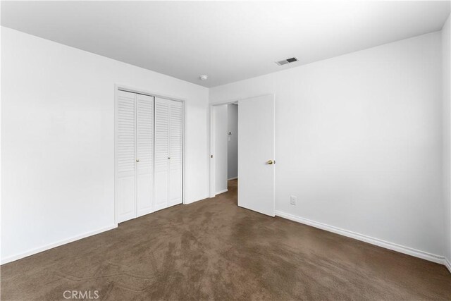 1467 W Southgate Ave, Fullerton, CA 92833 - unfurnished bedroom with a closet and dark carpet