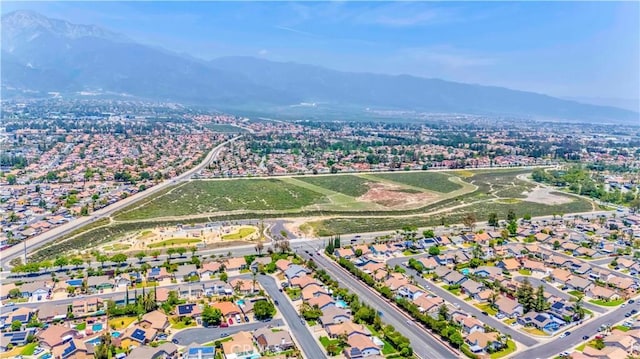 aerial view of property's location featuring a mountainous background
