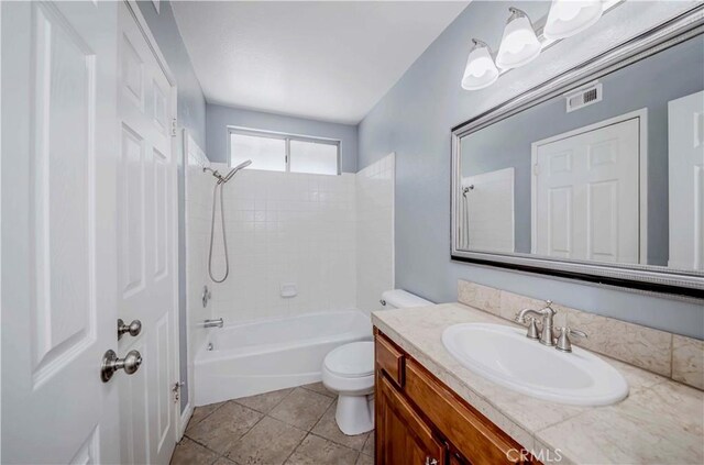 full bathroom featuring toilet, vanity, shower / washtub combination, and tile patterned flooring