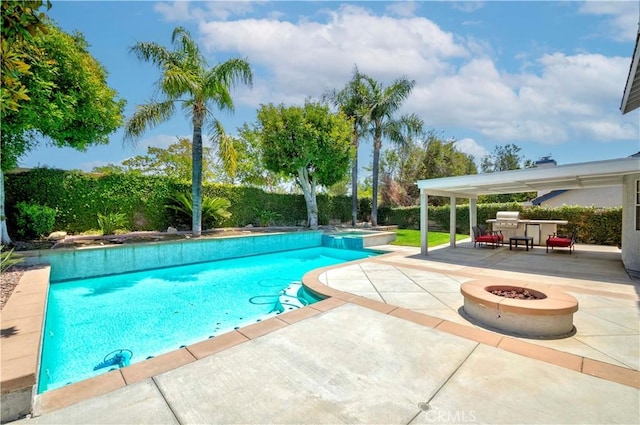 view of pool featuring a patio, an outdoor fire pit, and a fenced backyard