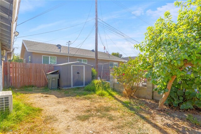 1335 W 11th St, Pomona, CA 91766 - back of house with a storage shed, fence, and an outdoor structure