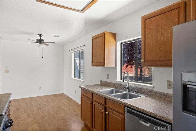 6383 Harvey Rd, Paradise, CA 95969 - kitchen with appliances with stainless steel finishes, a sink, plenty of natural light, and light wood-type flooring