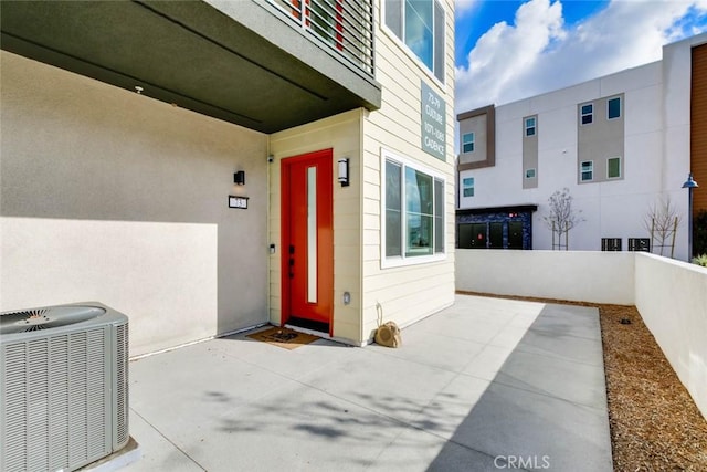 73 Culture, Irvine, CA 92618 - entrance to property with cooling unit, a patio area, and stucco siding