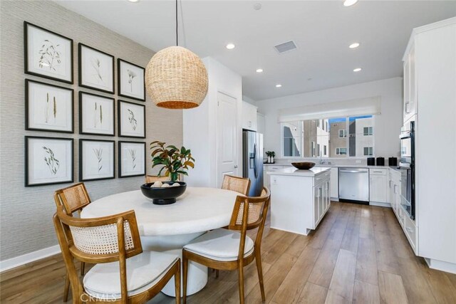 73 Culture, Irvine, CA 92618 - dining area featuring light wood-type flooring, recessed lighting, and baseboards