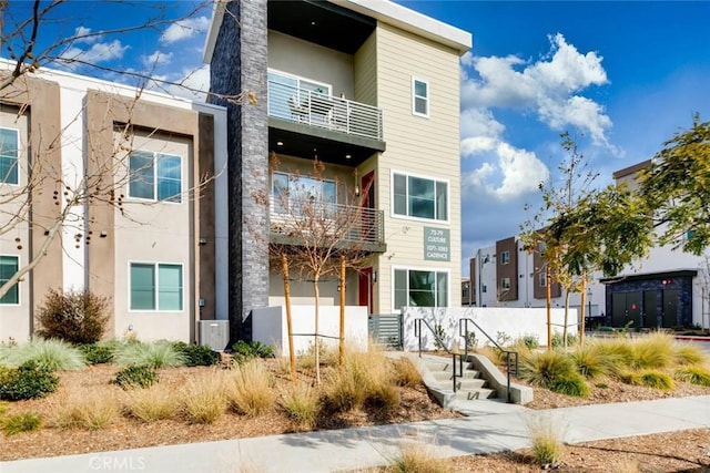 73 Culture, Irvine, CA 92618 - view of front facade with a balcony and stucco siding