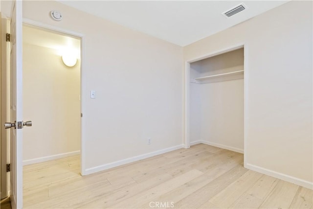 622 S Halcyon Rd, Arroyo Grande, CA 93420 - unfurnished bedroom featuring wood finished floors, baseboards, and a closet